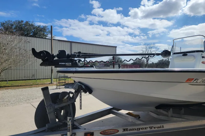 Slide: The Image of 2003 Ranger 2180 Bay Ranger boat on trailer with Minn Kota trolling motor. - 7