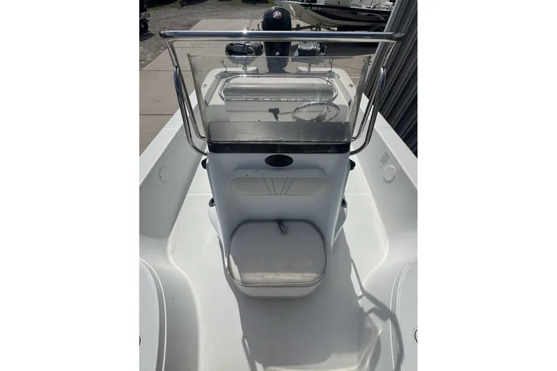 Slide: The Image of 2003 Ranger 2180 Bay Ranger boat console with steering wheel and seating. - 8