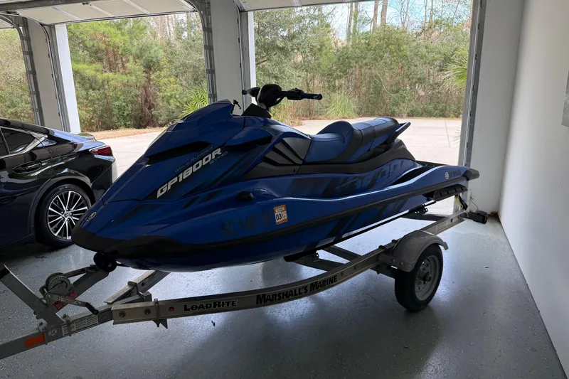 Slide: The Image of 2023 Yamaha WaveRunner GP1800R SVHO on trailer in garage setting. - 6