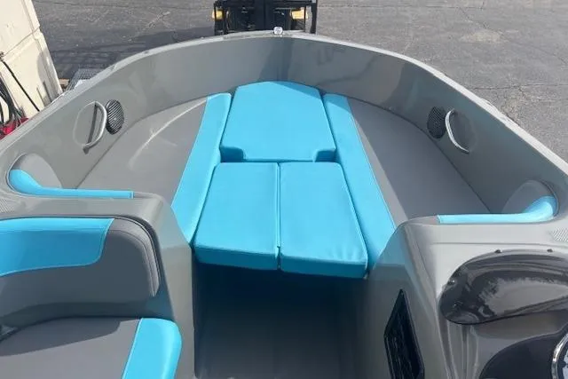 Slide: The Image of 2021 Bayliner Element E16 boat interior with blue and gray seating. - 6