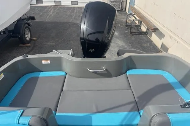 Slide: The Image of 2021 Bayliner Element E16 boat interior with blue and gray seating, rear view. - 7