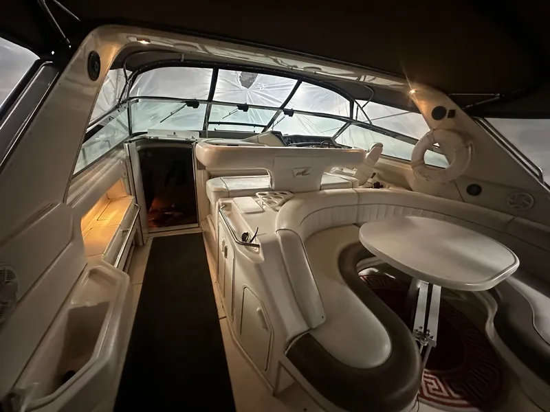 Slide: The Image of Interior of a 1996 Sea Ray 500 Sundancer yacht with luxurious seating area. - 27