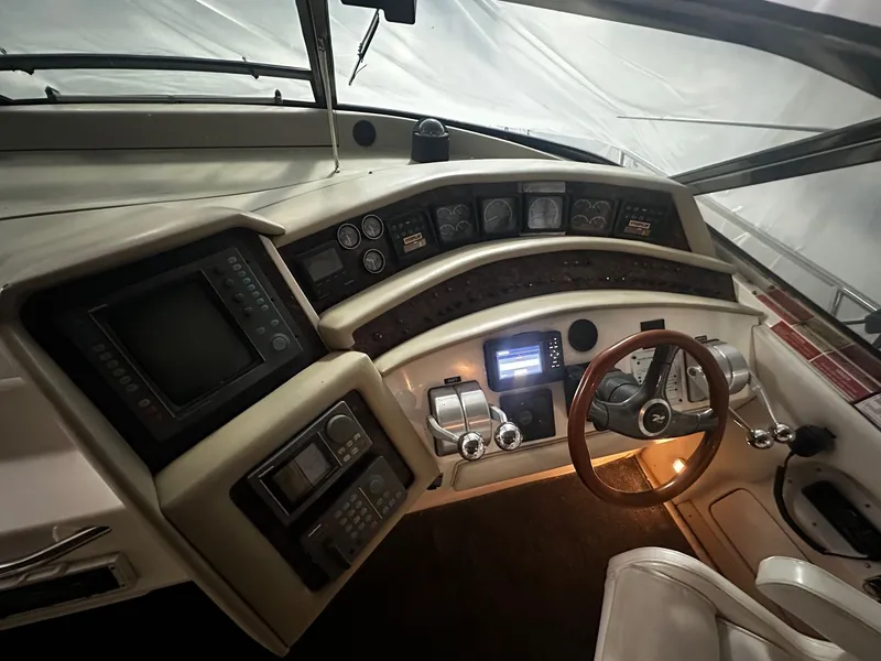 Slide: The Image of Interior view of a 1996 Sea Ray 500 Sundancer yacht cockpit. - 30