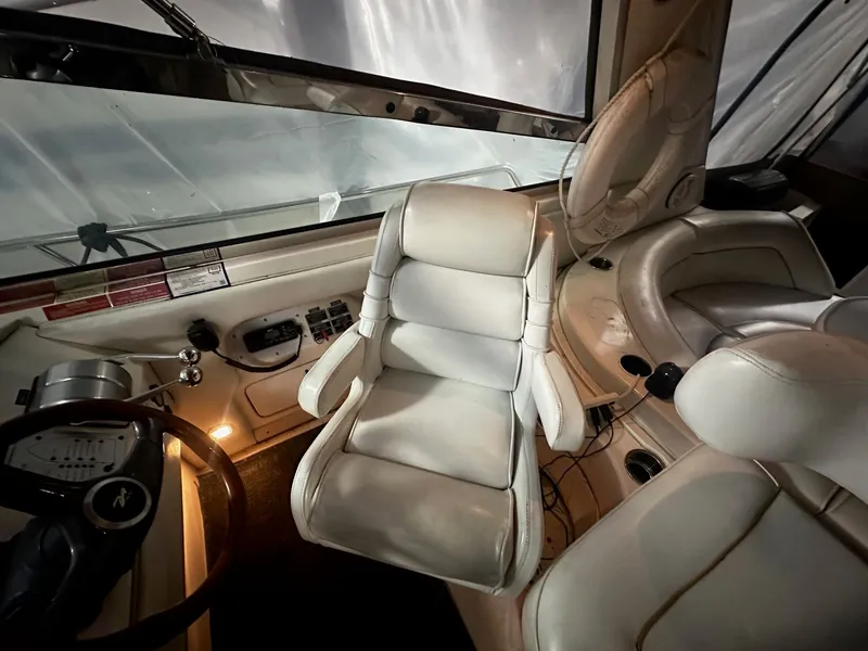 Slide: The Image of Interior of a 1996 Sea Ray 500 Sundancer boat with white leather seats. - 31