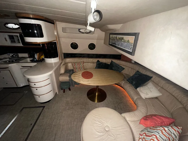Slide: The Image of Interior of a 1996 Sea Ray 500 Sundancer yacht with cozy seating area. - 38