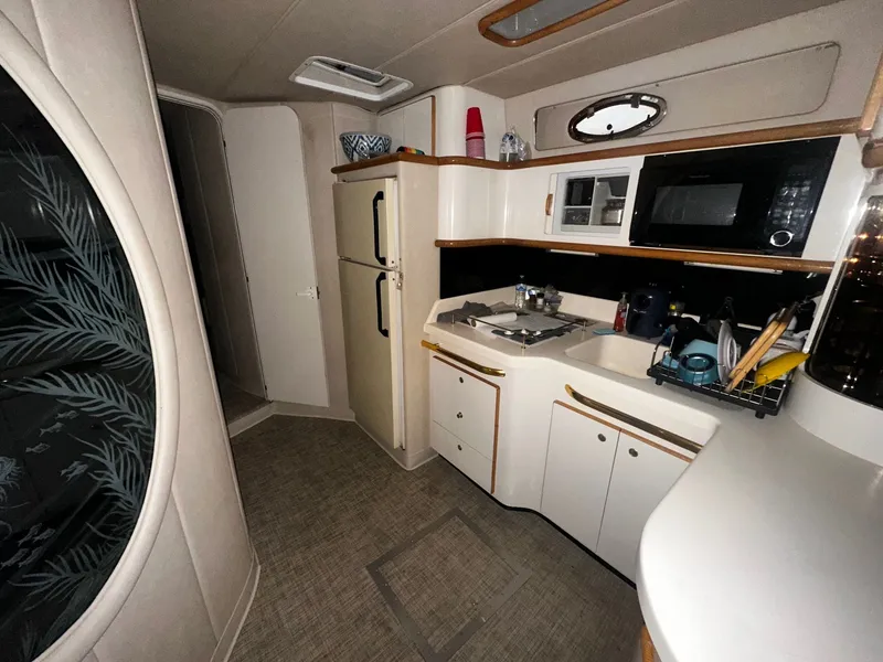 Slide: The Image of Interior of 1996 Sea Ray 500 Sundancer yacht kitchen area. - 41