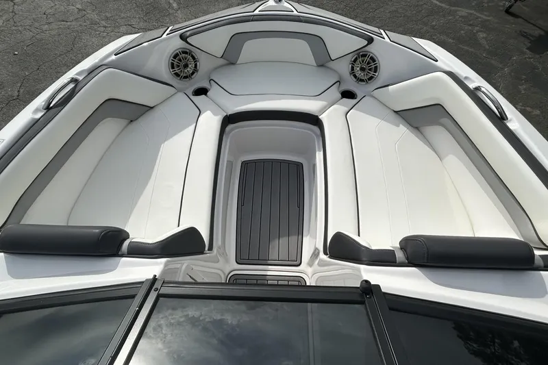 Slide: The Image of 2016 Yamaha Boats AR192 interior with white seating and speakers. - 10