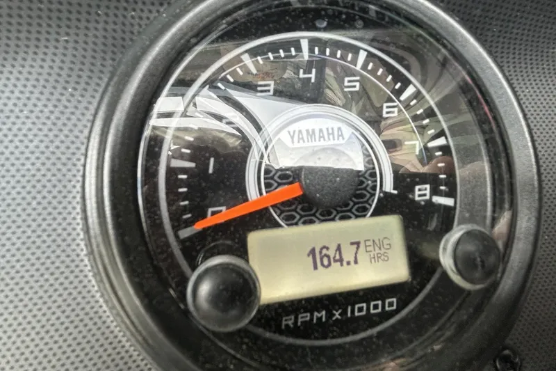 Slide: The Image of Close-up of 2016 Yamaha AR192 boat tachometer showing 164.7 engine hours. - 6