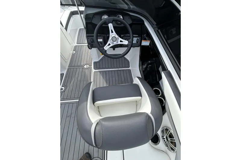 Slide: The Image of 2016 Yamaha Boats AR192 cockpit with steering wheel and cushioned seating. - 8