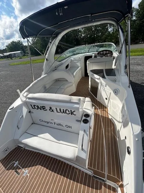 Slide: The Image of 2013 Rinker 290 Express Cruiser interior with "Love & Luck" text, Chagrin Falls, OH. - 48