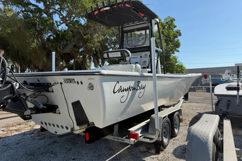 Slide: The Image of 2022 Canyon Bay 28h boat on trailer, featuring Carbon Kevlar construction. - 10