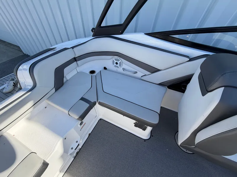 Slide: The Image of Interior of a 2020 Yamaha AR240 boat with gray upholstery. - 10
