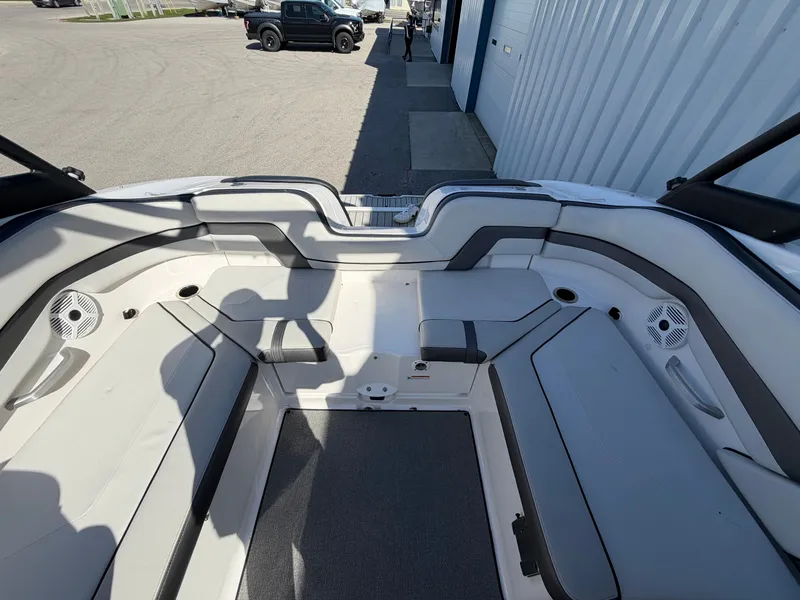 Slide: The Image of Interior of a 2020 Yamaha AR240 boat with gray seating. - 11