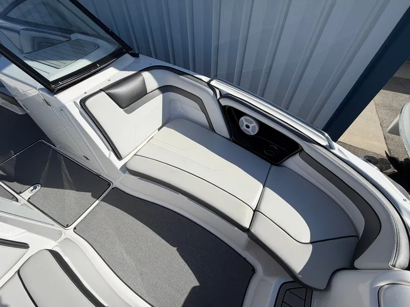 Slide: The Image of Interior of a 2020 Yamaha AR240 boat with gray upholstery. - 6