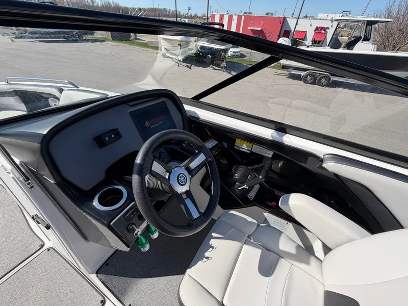 Slide: The Image of Interior view of 2020 Yamaha AR240 boat cockpit with steering wheel. - 7