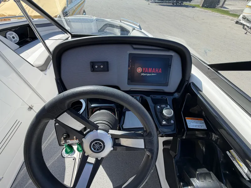 Slide: The Image of Yamaha AR240 2020 boat dashboard with steering wheel and display. - 8