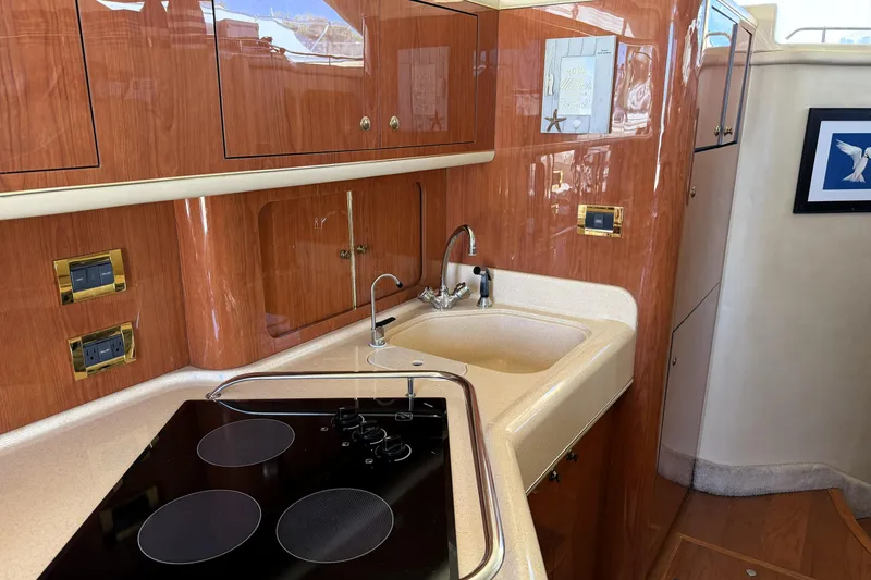 Slide: The Image of Luxurious kitchen interior of 2000 Sea Ray 450 Express Bridge yacht. - 12