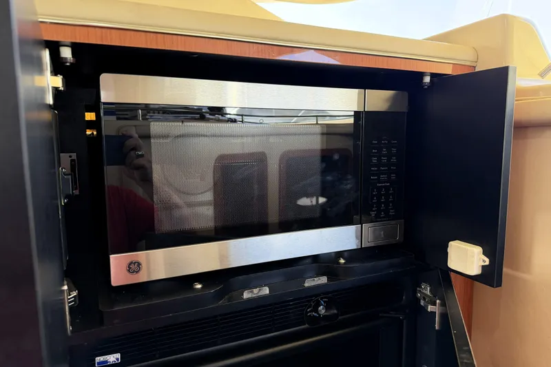 Slide: The Image of Microwave inside 2000 Sea Ray 450 Express Bridge yacht kitchen cabinet. - 13