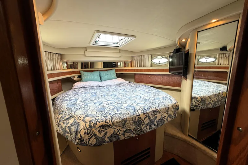 Slide: The Image of Luxurious bedroom interior of 2000 Sea Ray 450 Express Bridge yacht with skylight and mirror. - 19