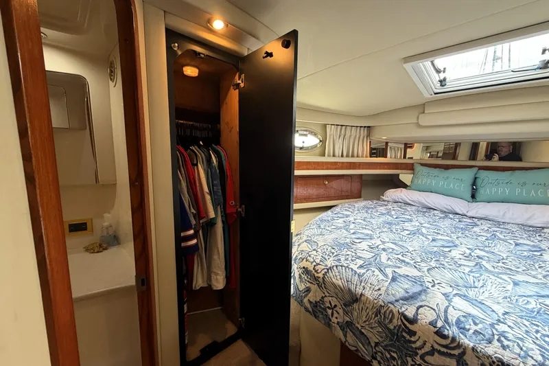 Slide: The Image of Interior of 2000 Sea Ray 450 Express Bridge with cozy bedroom and closet space. - 21