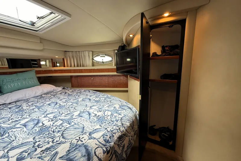 Slide: The Image of Luxurious cabin interior of 2000 Sea Ray 450 Express Bridge yacht with cozy bedding. - 22