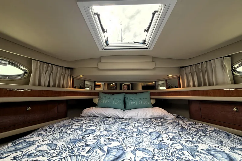 Slide: The Image of Luxurious cabin interior of 2000 Sea Ray 450 Express Bridge yacht with skylight. - 23