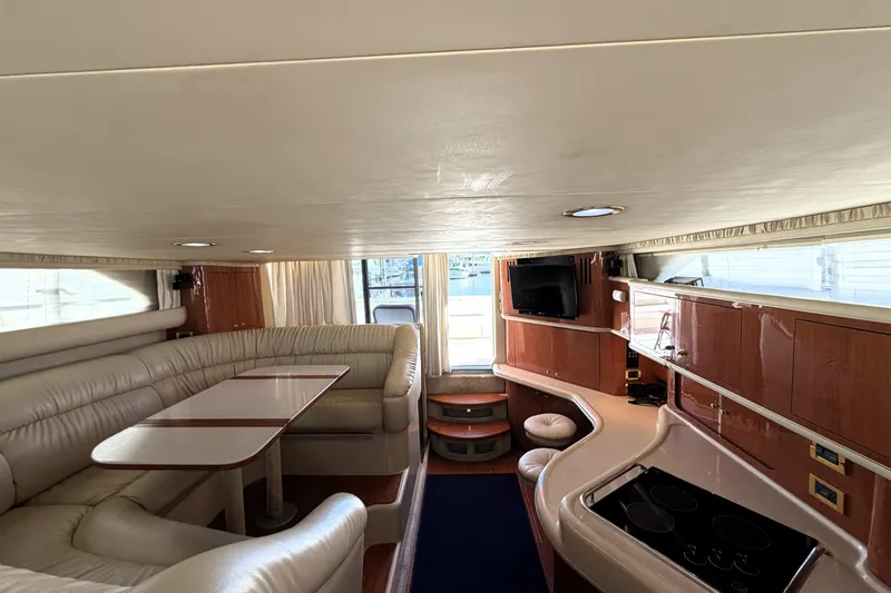 Slide: The Image of Luxurious interior of a 2000 Sea Ray 450 Express Bridge yacht with elegant seating and modern amenities. - 28