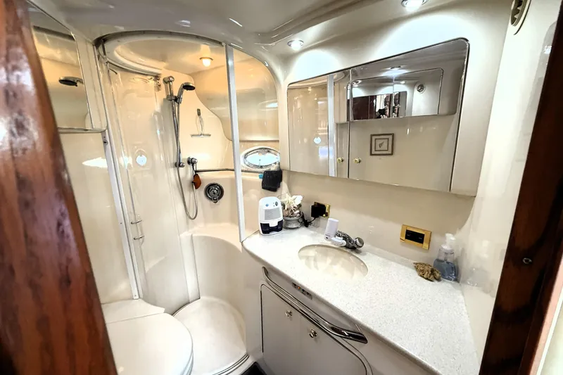 Slide: The Image of Luxurious bathroom interior of 2000 Sea Ray 450 Express Bridge yacht, featuring modern amenities. - 30