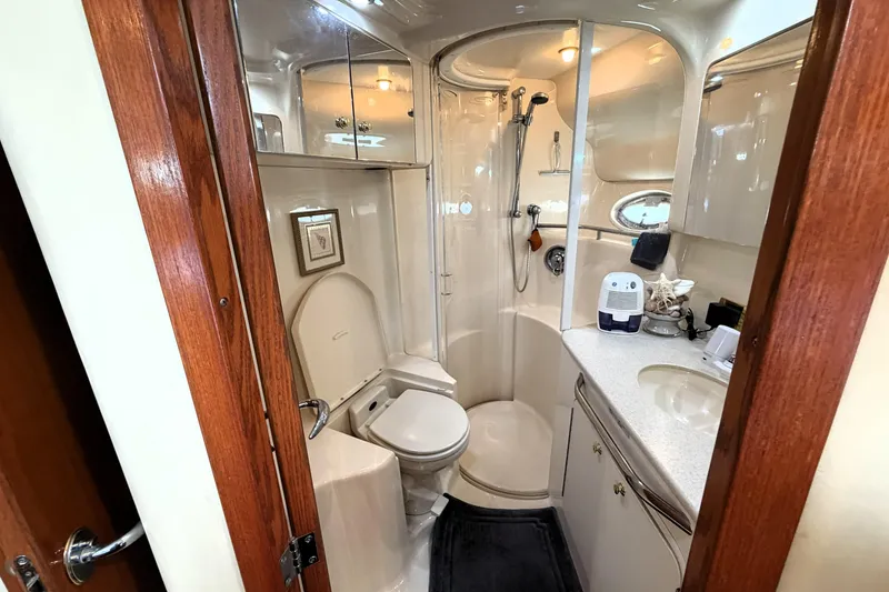 Slide: The Image of Luxurious bathroom in 2000 Sea Ray 450 Express Bridge yacht, featuring modern amenities. - 31