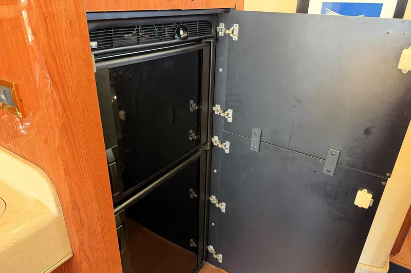 Slide: The Image of Open refrigerator in 2000 Sea Ray 450 Express Bridge yacht interior. - 40