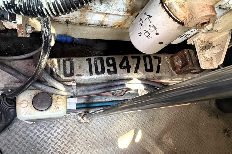 Slide: The Image of Engine compartment of 2000 Sea Ray 450 Express Bridge with serial number 1094707 visible. - 63