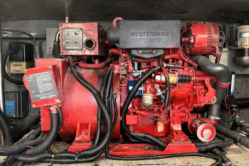 Slide: The Image of Engine room of a 2000 Sea Ray 450 Express Bridge with Westerbeke generator. - 67