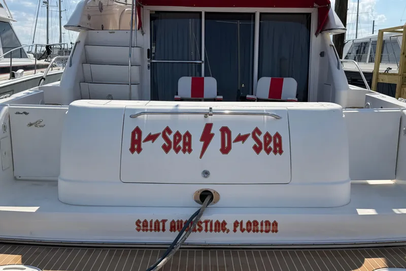 Slide: The Image of Cozy bedroom interior of 2000 Sea Ray 450 Express Bridge yacht with blue bedding. - 71
