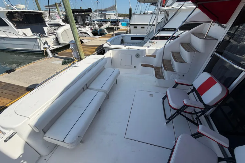 Slide: The Image of Luxurious cabin interior of 2000 Sea Ray 450 Express Bridge with cozy bedding. - 72