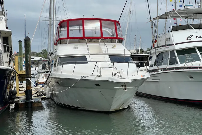 Slide: The Image of Interior cabin of 2000 Sea Ray 450 Express Bridge with storage and Dometic cooler. - 75