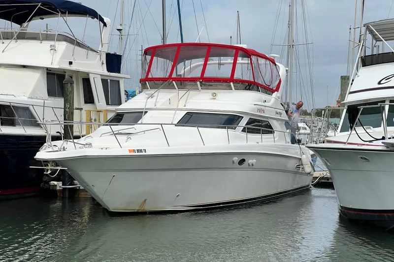 Slide: The Image of Interior cabin of a 2000 Sea Ray 450 Express Bridge with storage and Dometic cooler. - 76