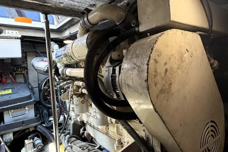 Slide: The Image of Engine room of a 2000 Sea Ray 450 Express Bridge yacht, showcasing mechanical components. - 79