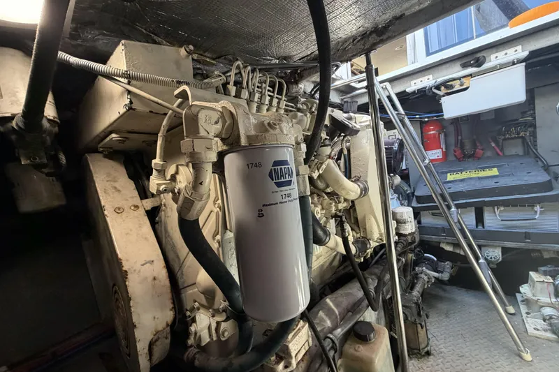 Slide: The Image of Engine room of a 2000 Sea Ray 450 Express Bridge with visible components and equipment. - 80