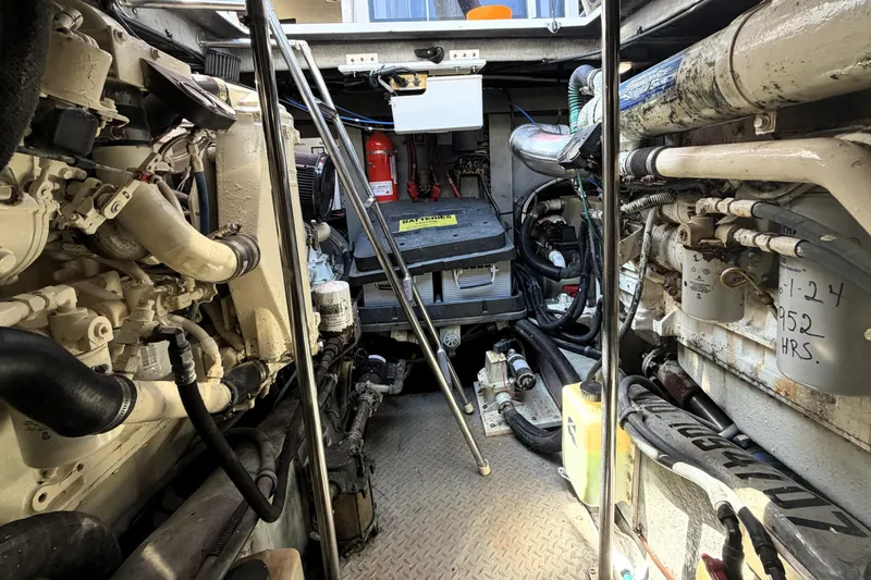 Slide: The Image of Engine room of a 2000 Sea Ray 450 Express Bridge yacht, showcasing mechanical components. - 81