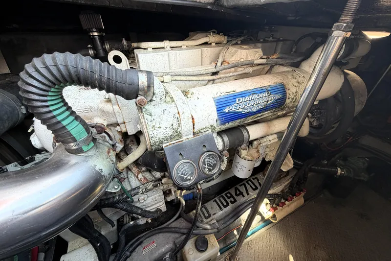 Slide: The Image of Engine compartment of a 2000 Sea Ray 450 Express Bridge, featuring Diamond Performance Series components. - 82