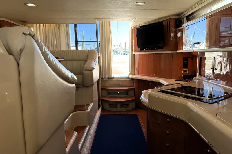 Slide: The Image of Luxurious interior of a 2000 Sea Ray 450 Express Bridge yacht with modern amenities. - 9