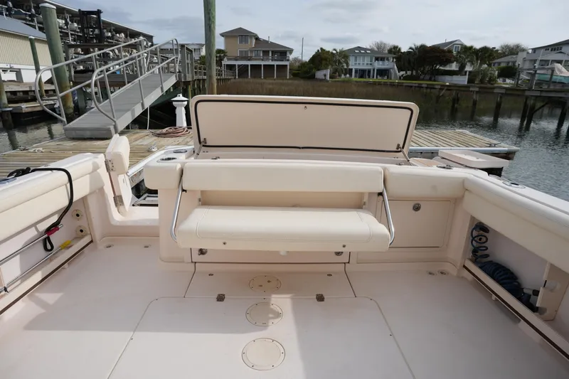 Slide: The Image of 2009 Grady-White Express 330 boat interior with seating and dock view. - 15