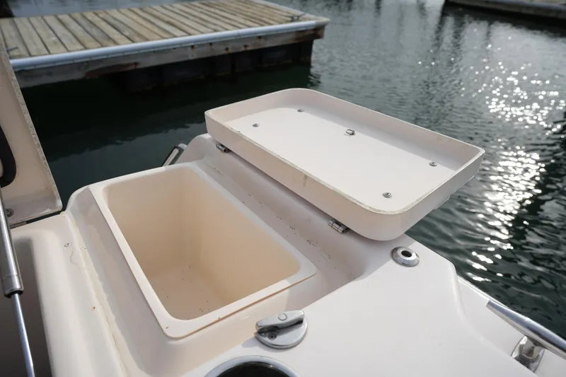 Slide: The Image of Open storage compartment on 2009 Grady-White Express 330 boat, dockside view. - 16