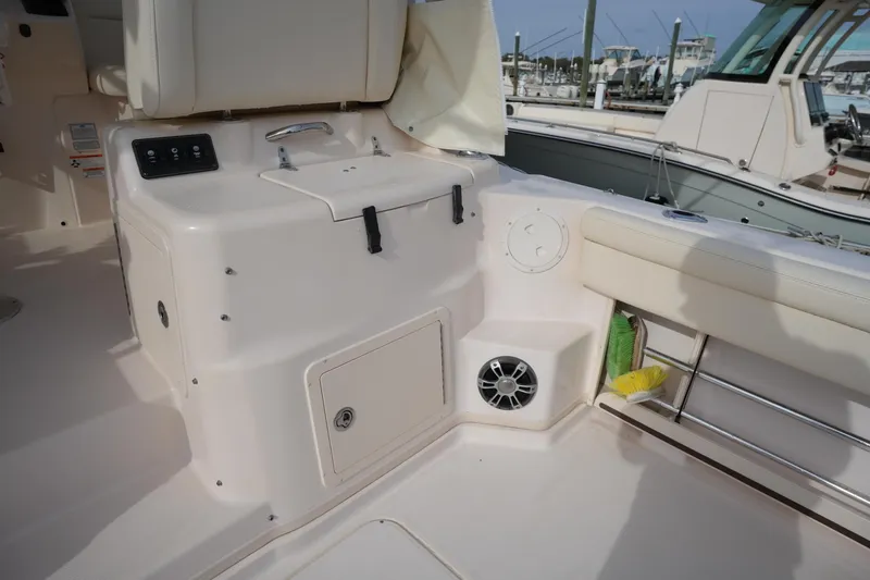 Slide: The Image of 2009 Grady-White Express 330 boat interior with seating and storage compartments. - 22