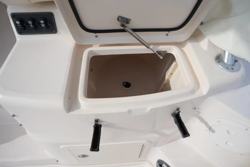 Slide: The Image of Open storage compartment on 2009 Grady-White Express 330 boat deck. - 24