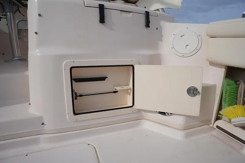 Slide: The Image of Open storage compartment on 2009 Grady-White Express 330 boat deck. - 25
