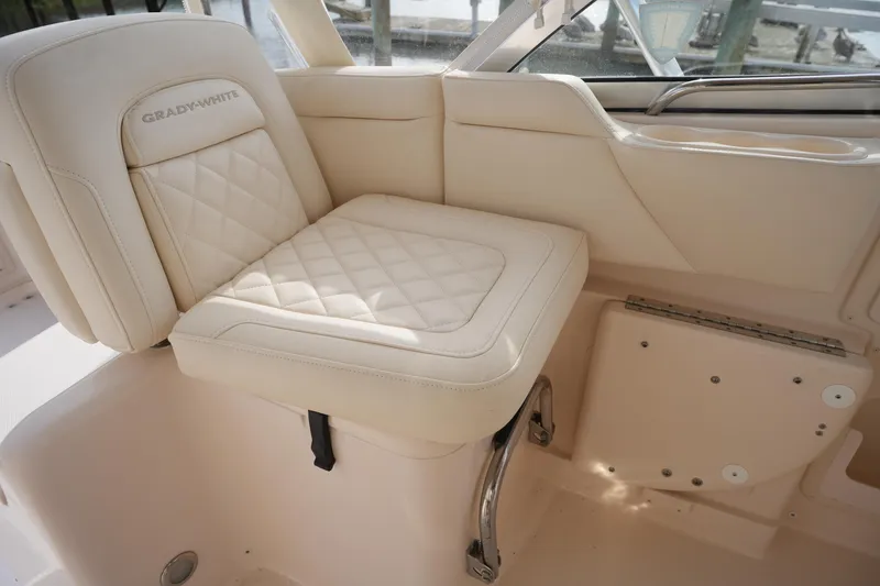 Slide: The Image of 2009 Grady-White Express 330 boat seat with quilted upholstery, showcasing luxury and comfort. - 27