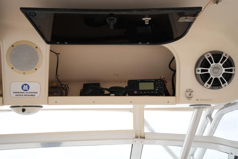 Slide: The Image of 2009 Grady-White Express 330 boat interior with speakers and radio equipment. - 41