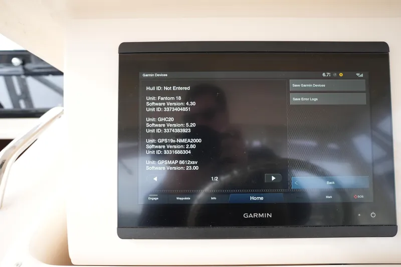Slide: The Image of Garmin device display on 2009 Grady-White Express 330 boat, showing software versions. - 44