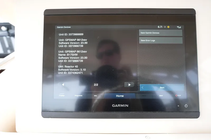 Slide: The Image of Garmin GPS display on 2009 Grady-White Express 330 boat, showing device information. - 45